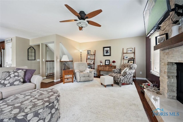 6200 Swiss Garden Rd, Toledo, OH 43612 - living room with a ceiling fan, a fireplace, and baseboards
