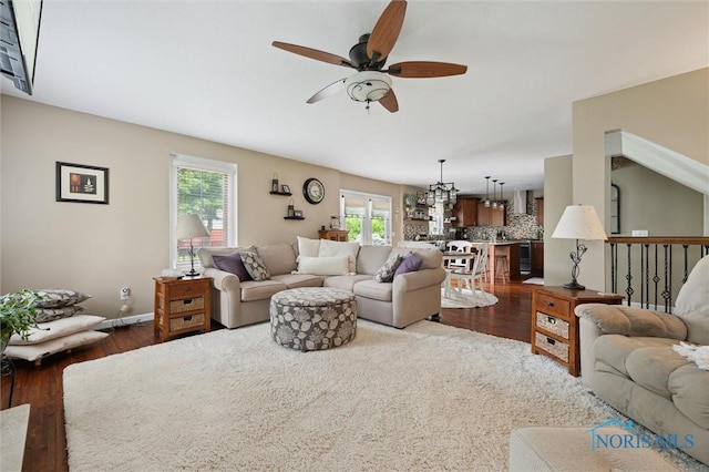 6200 Swiss Garden Rd, Toledo, OH 43612 - living area featuring a ceiling fan, wood finished floors, and baseboards