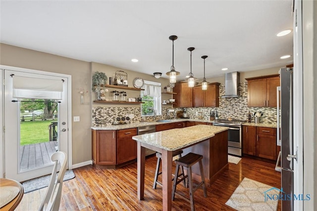 6200 Swiss Garden Rd, Toledo, OH 43612 - kitchen featuring appliances with stainless steel finishes, wall chimney range hood, open shelves, brown cabinets, and recessed lighting