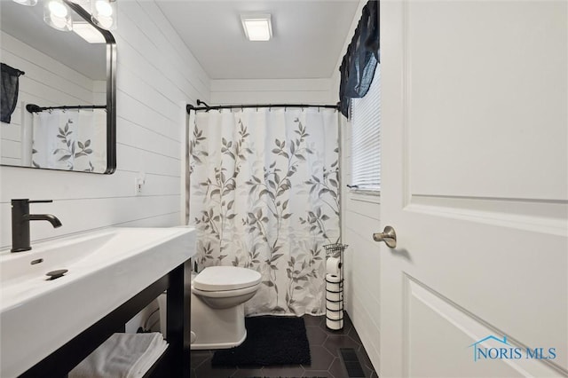6200 Swiss Garden Rd, Toledo, OH 43612 - bathroom with vanity, toilet, tile patterned floors, a shower with curtain, and wood walls