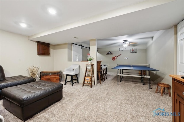 6200 Swiss Garden Rd, Toledo, OH 43612 - playroom with light colored carpet, a barn door, and ceiling fan