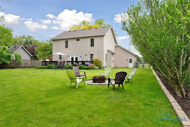 6200 Swiss Garden Rd, Toledo, OH 43612 - back of property featuring an outdoor fire pit and a wooden deck