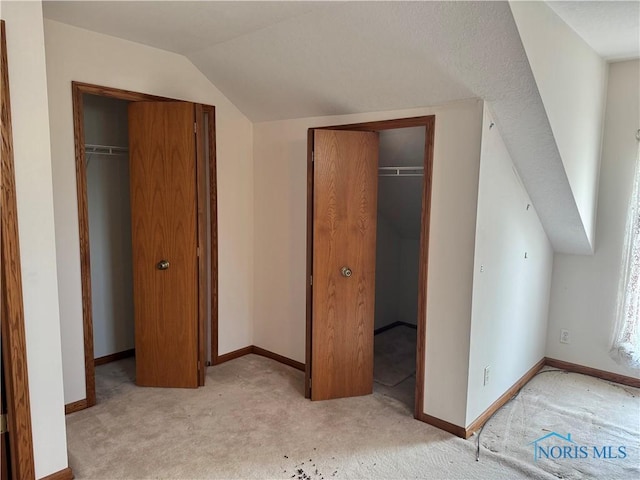 429 N Park St, Deshler, OH 43516 - unfurnished bedroom featuring light colored carpet, lofted ceiling, and a closet