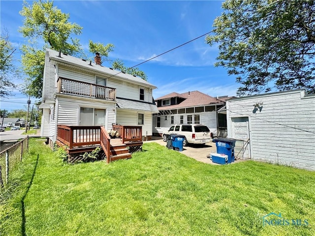 2135 Airport Hwy, Toledo, OH 43609 - back of property with a balcony, a deck, and a chimney