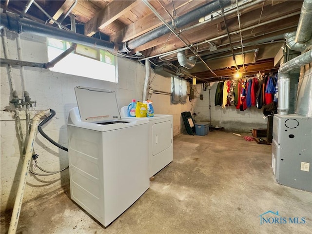 2135 Airport Hwy, Toledo, OH 43609 - below grade area featuring washer and dryer and heating unit