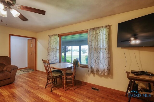 2534 Blanchard Ave, Findlay, OH 45840 - dining room featuring wood finished floors, ceiling fan, and baseboards