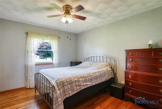 2534 Blanchard Ave, Findlay, OH 45840 - bedroom featuring wood finished floors, ceiling fan, and baseboards