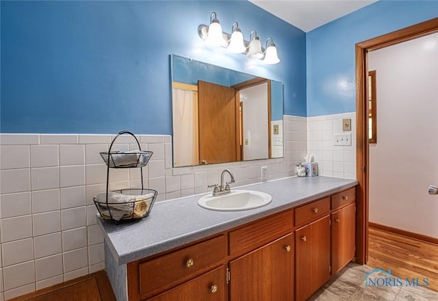 2534 Blanchard Ave, Findlay, OH 45840 - bathroom with vanity, tile walls, and wainscoting