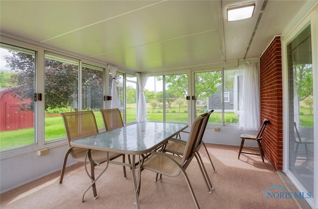 2534 Blanchard Ave, Findlay, OH 45840 - sunroom featuring plenty of natural light, outdoor dining area, and baseboards