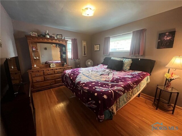 4448 Helmond Ct, Toledo, OH 43611 - bedroom featuring wood finished floors and baseboards