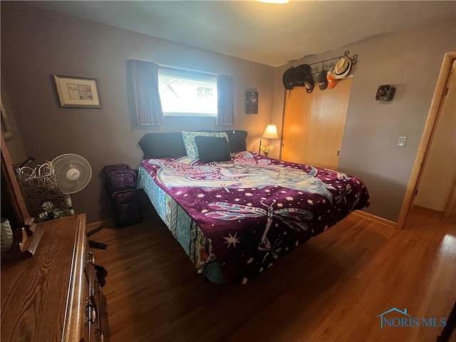 4448 Helmond Ct, Toledo, OH 43611 - bedroom featuring wood finished floors and baseboards