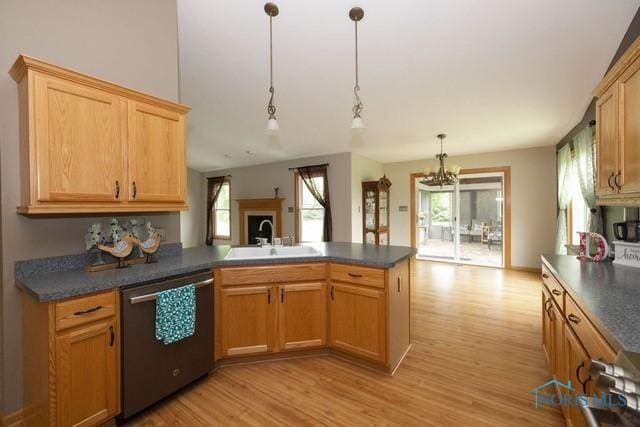 1033 Joseph Rd, Luckey, OH 43443 - kitchen with stainless steel dishwasher, a sink, light wood-type flooring, a peninsula, and healthy amount of natural light
