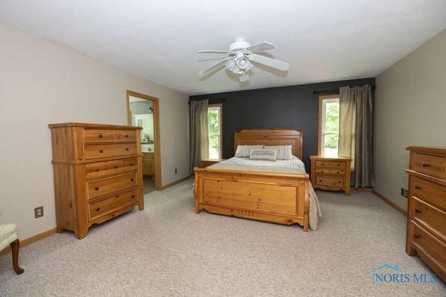 1033 Joseph Rd, Luckey, OH 43443 - bedroom with light colored carpet, baseboards, and ceiling fan