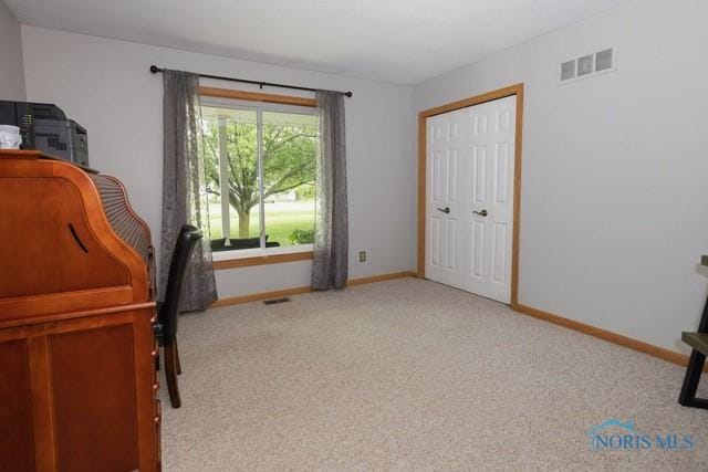 1033 Joseph Rd, Luckey, OH 43443 - home office with light colored carpet and baseboards