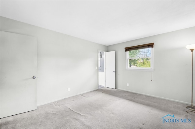 1 Hawthorne Dr, Delta, OH 43515 - unfurnished room featuring carpet and baseboards