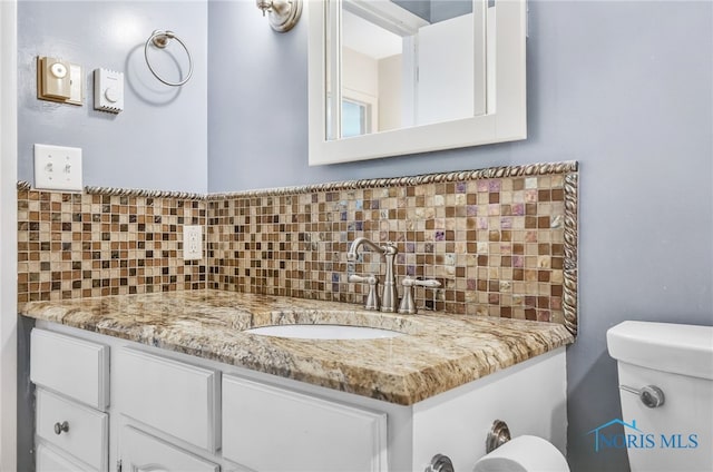 1 Hawthorne Dr, Delta, OH 43515 - half bath featuring backsplash, vanity, and toilet