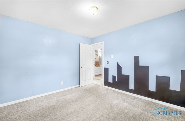 1 Hawthorne Dr, Delta, OH 43515 - carpeted spare room featuring baseboards
