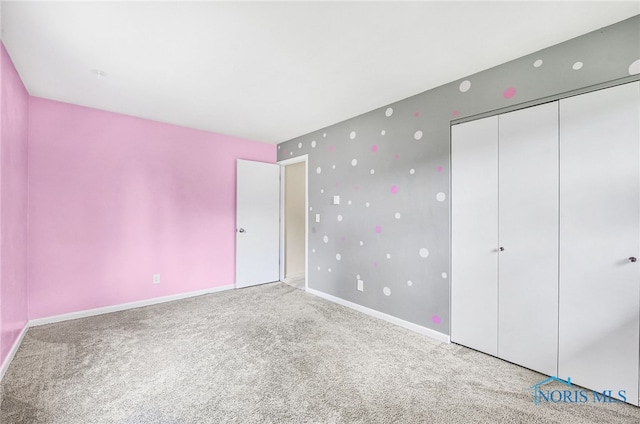 1 Hawthorne Dr, Delta, OH 43515 - unfurnished bedroom featuring carpet flooring, baseboards, and a closet