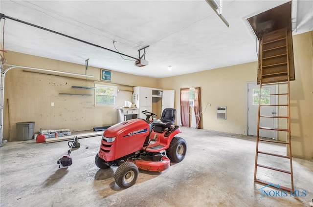 1 Hawthorne Dr, Delta, OH 43515 - garage with a garage door opener and heating unit