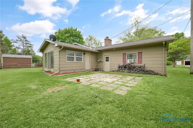 1 Hawthorne Dr, Delta, OH 43515 - back of house with a chimney and a patio