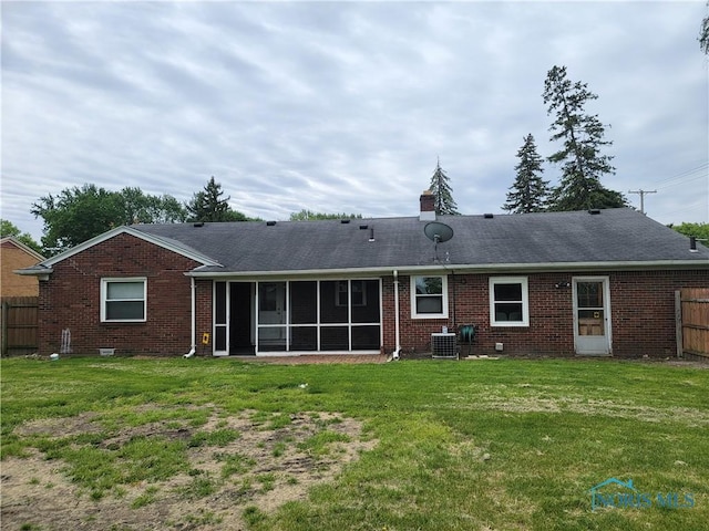 3434 Muirfield Ave, Toledo, OH 43614 - back of property featuring central air condition unit, brick siding, a sunroom, and roof with shingles