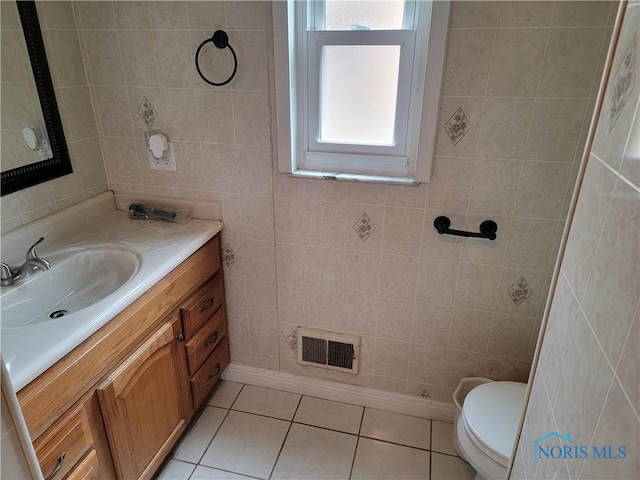 3434 Muirfield Ave, Toledo, OH 43614 - half bath featuring tile patterned floors, vanity, toilet, and tile walls