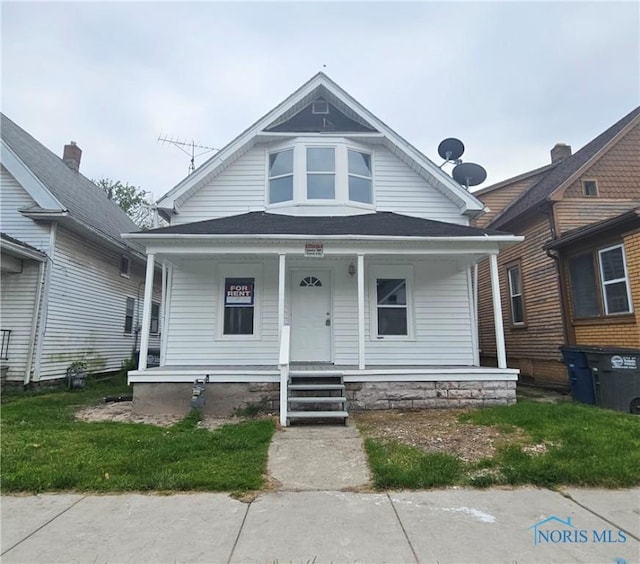 1545 Buckingham St, Toledo, OH 43607 - view of front facade with a porch