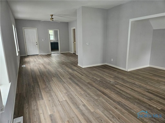 1545 Buckingham St, Toledo, OH 43607 - unfurnished room with ceiling fan, dark wood-style floors, and baseboards