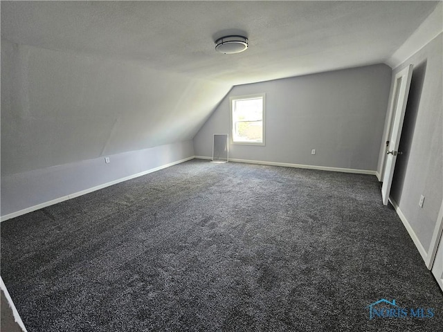 1545 Buckingham St, Toledo, OH 43607 - additional living space featuring lofted ceiling, carpet, and baseboards