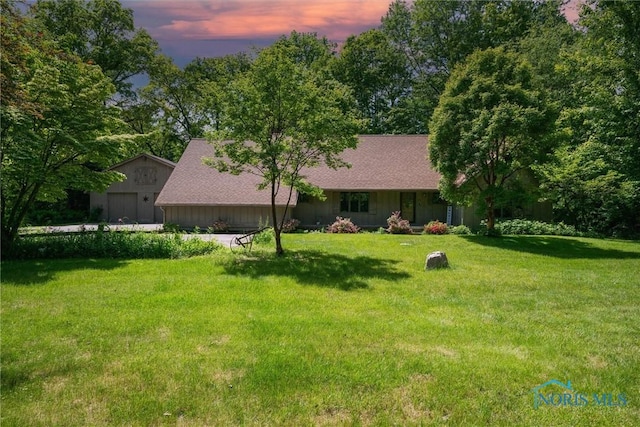 12949 Shaffer Rd, Swanton, OH 43558 - view of front of home featuring a front yard, roof with shingles, and a garage