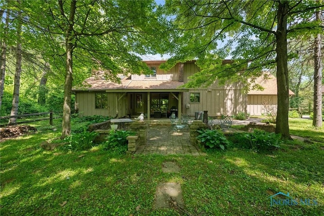 12949 Shaffer Rd, Swanton, OH 43558 - back of property with a patio area and board and batten siding