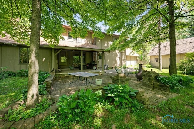 12949 Shaffer Rd, Swanton, OH 43558 - back of house with a patio area and board and batten siding
