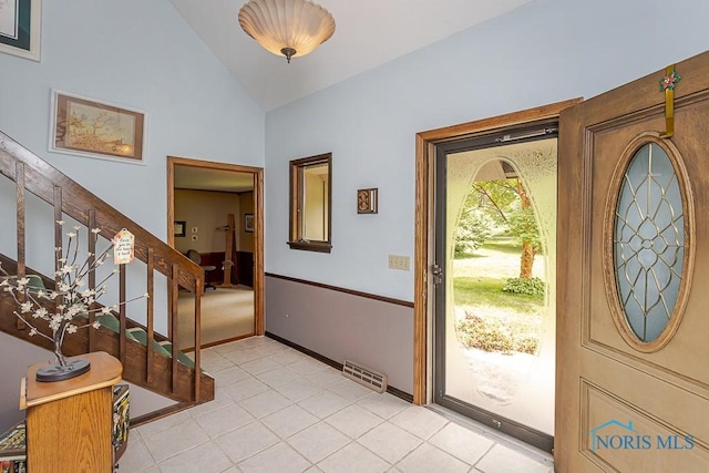12949 Shaffer Rd, Swanton, OH 43558 - foyer with stairs, lofted ceiling, light tile patterned flooring, and baseboards
