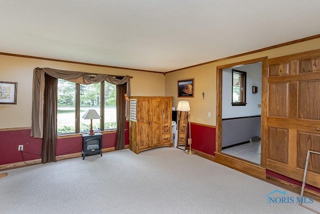 12949 Shaffer Rd, Swanton, OH 43558 - carpeted empty room featuring crown molding, baseboards, and a wood stove