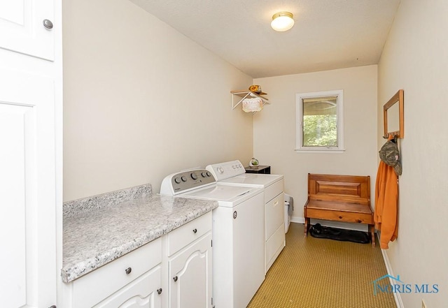 12949 Shaffer Rd, Swanton, OH 43558 - washroom featuring washing machine and dryer, cabinet space, and baseboards