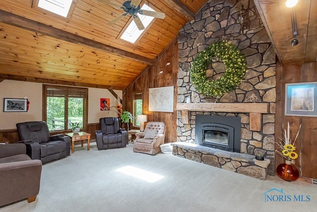 12949 Shaffer Rd, Swanton, OH 43558 - living area featuring wood walls, a skylight, wooden ceiling with exposed beams, carpet flooring, and a wainscoted wall