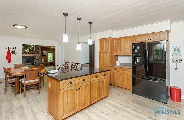 12949 Shaffer Rd, Swanton, OH 43558 - kitchen featuring black refrigerator with ice dispenser, light wood-type flooring, dark countertops, pendant lighting, and wooden ceiling