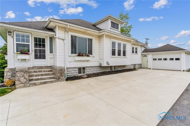 430 E 3rd St, Ottawa, OH 45875 - view of front of property with entry steps, concrete driveway, and roof with shingles