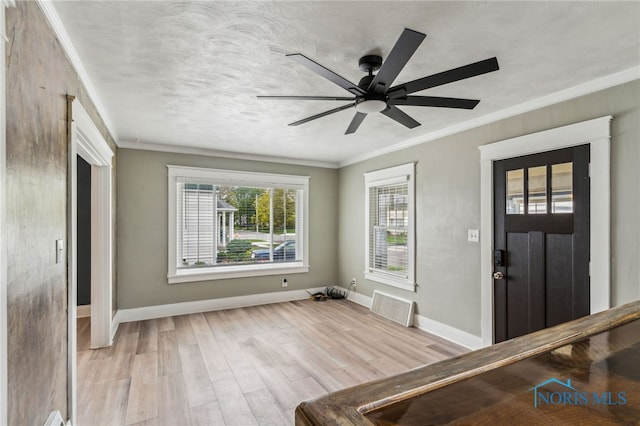 430 E 3rd St, Ottawa, OH 45875 - entrance foyer featuring ornamental molding, light wood-type flooring, baseboards, and a ceiling fan
