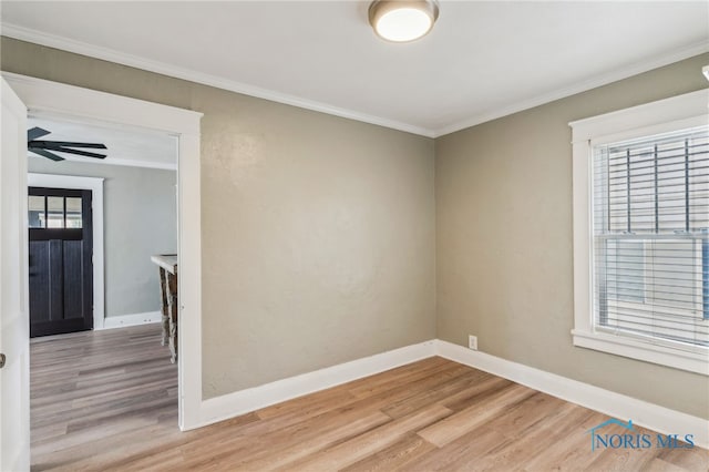 430 E 3rd St, Ottawa, OH 45875 - spare room featuring light wood finished floors, crown molding, baseboards, and ceiling fan
