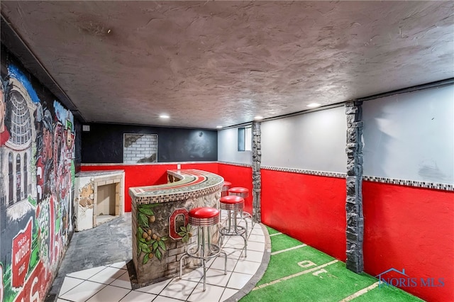 430 E 3rd St, Ottawa, OH 45875 - indoor dry bar with a wainscoted wall and tile patterned floors