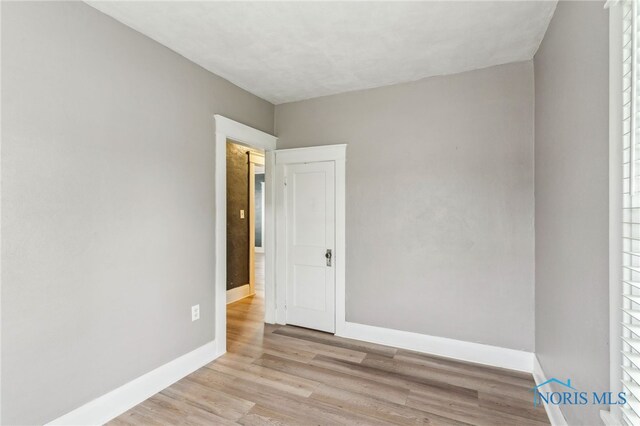 430 E 3rd St, Ottawa, OH 45875 - empty room with baseboards and light wood-style floors