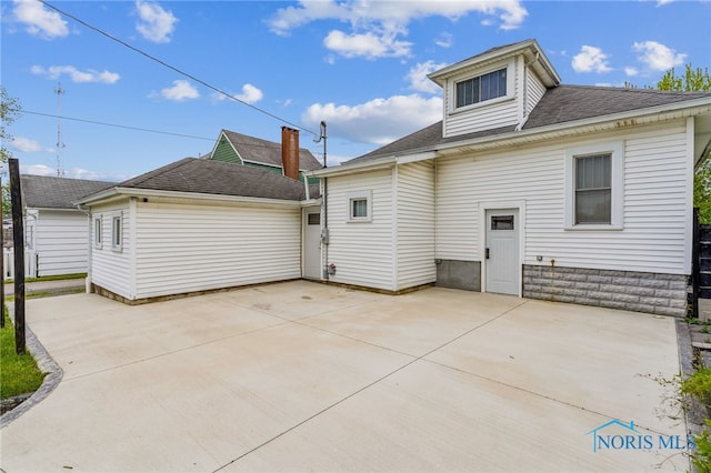 430 E 3rd St, Ottawa, OH 45875 - back of house with a patio and roof with shingles