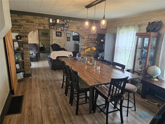 201 W Wabash St, Liberty Center, OH 43532 - dining space with arched walkways and wood finished floors