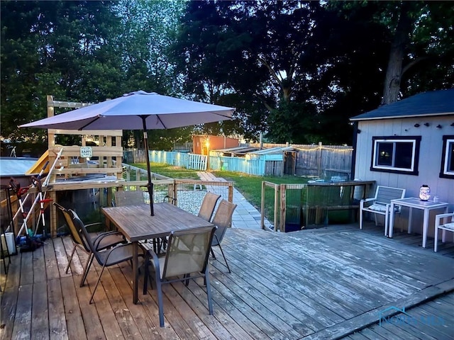 201 W Wabash St, Liberty Center, OH 43532 - wooden terrace with outdoor dining space and a fenced backyard