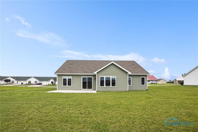 116 Wirth Ln, Sherwood, OH 43556 - back of property with a yard, a patio, and a shingled roof