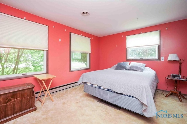 206 N Park Dr, Mccomb, OH 45858 - carpeted bedroom featuring multiple windows and baseboard heating
