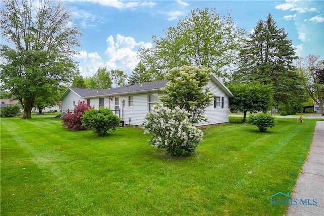 206 N Park Dr, Mccomb, OH 45858 - view of home's exterior featuring a lawn