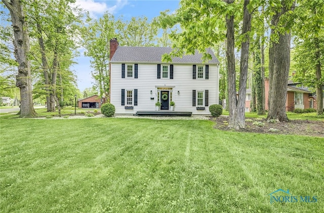 524 Sutton Pl, Findlay, OH 45840 - back of house with a chimney and a yard