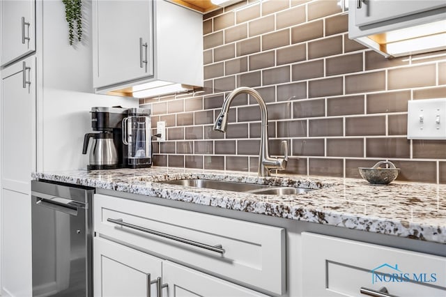 524 Sutton Pl, Findlay, OH 45840 - kitchen featuring a sink, decorative backsplash, light stone countertops, and white cabinetry